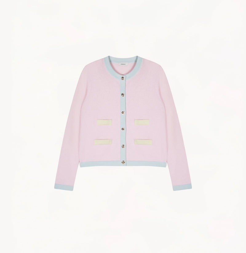 Light pink cashmere cardigan with baby blue and pale yellow contrast trims and shoulder pads.