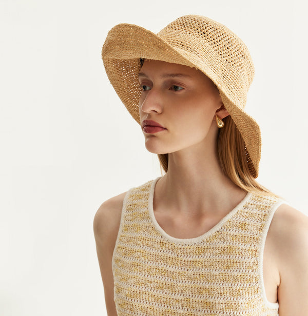 Sand-colored raffia sun hat with adjustable inner band. front-view