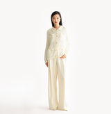 White sheer cardigan in velvet-metallic blend with horizontal pointelle pattern. front-view