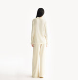 White sheer cardigan in velvet-metallic blend with horizontal pointelle pattern. rear-view