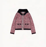 Heather black/white speckled tweed jacket for women with shoulder pads and detachable hood.