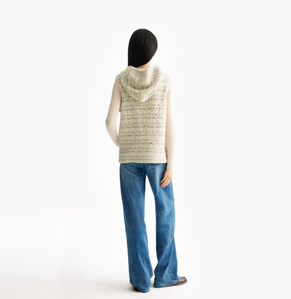 White womens tweed vest with relaxed fit hooded design metallic ring zip high collar and adjustable drawstring hem. rear-view.