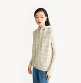 White womens tweed vest with relaxed fit hooded design metallic ring zip high collar and adjustable drawstring hem. left-view.