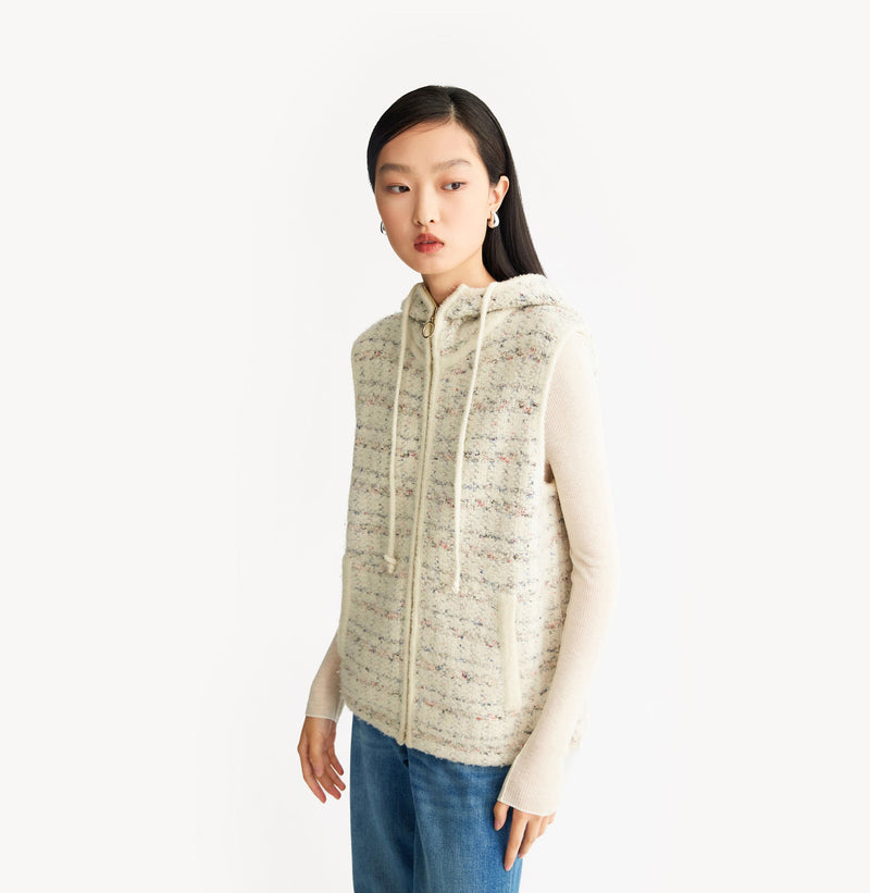 White womens tweed vest with relaxed fit hooded design metallic ring zip high collar and adjustable drawstring hem. left-view.