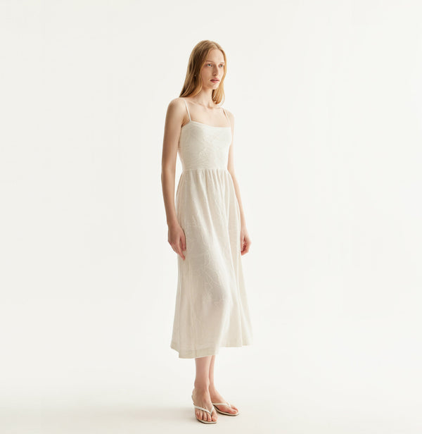 Chinese-inspired lily floral dress with cinched waist and gathered pleats in white. front-view
