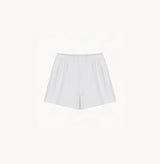 White sheepskin shorts with relaxed pleated design and elastic waistband.