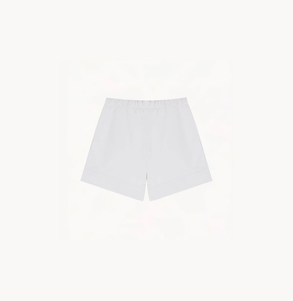 White sheepskin shorts with relaxed pleated design and elastic waistband.