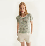 White sheepskin shorts with relaxed pleated design and elastic waistband. left-view