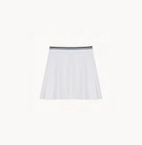 White cotton pleated mini skirt with loose flared silhouette and contrasting trim waistband.