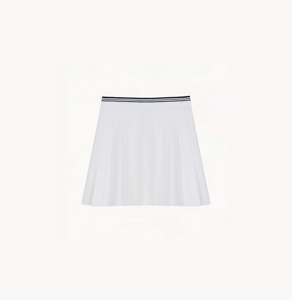 White cotton pleated mini skirt with loose flared silhouette and contrasting trim waistband.