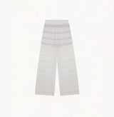 White linen trousers with sequin accents and straight-leg design.