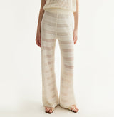 White linen trousers with sequin accents and straight-leg design. front-view