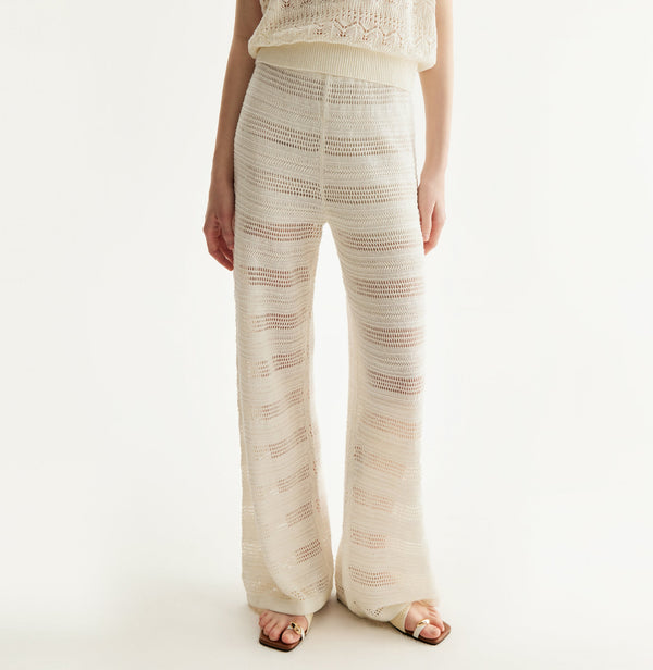 White linen trousers with sequin accents and straight-leg design. front-view
