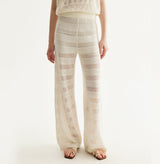White linen trousers with sequin accents and straight-leg design.left-view