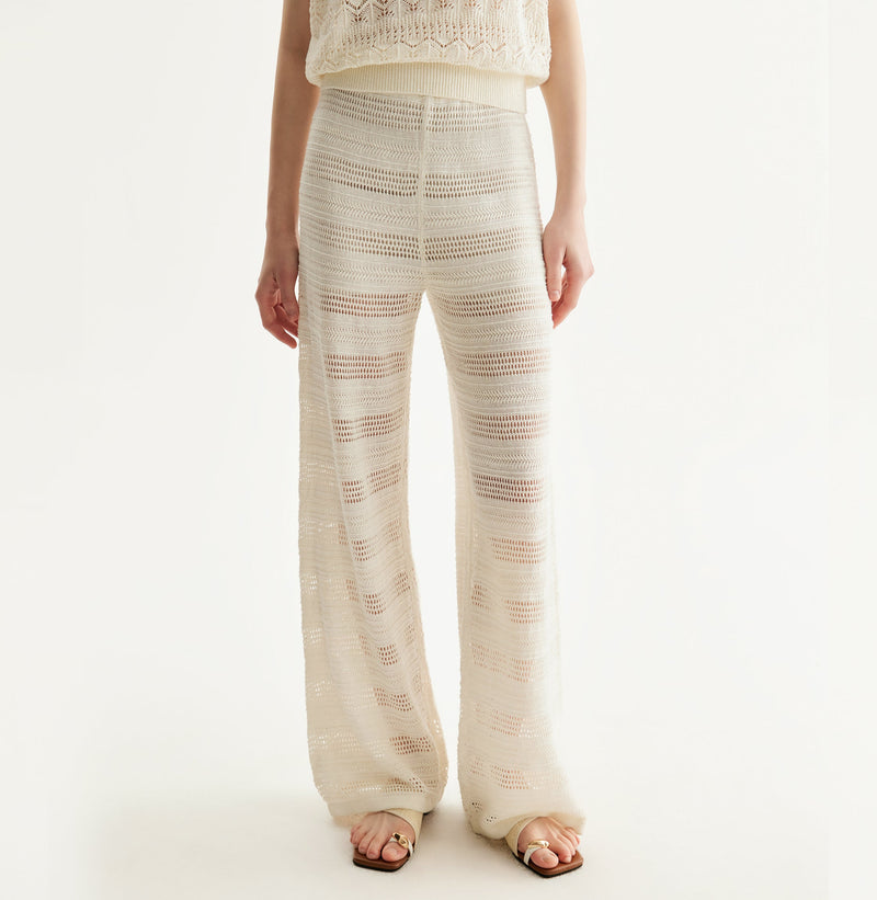 White linen trousers with sequin accents and straight-leg design.left-view