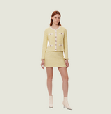 Wool boucle coat in lemon. front-view