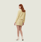 Wool boucle coat in lemon. rear-view