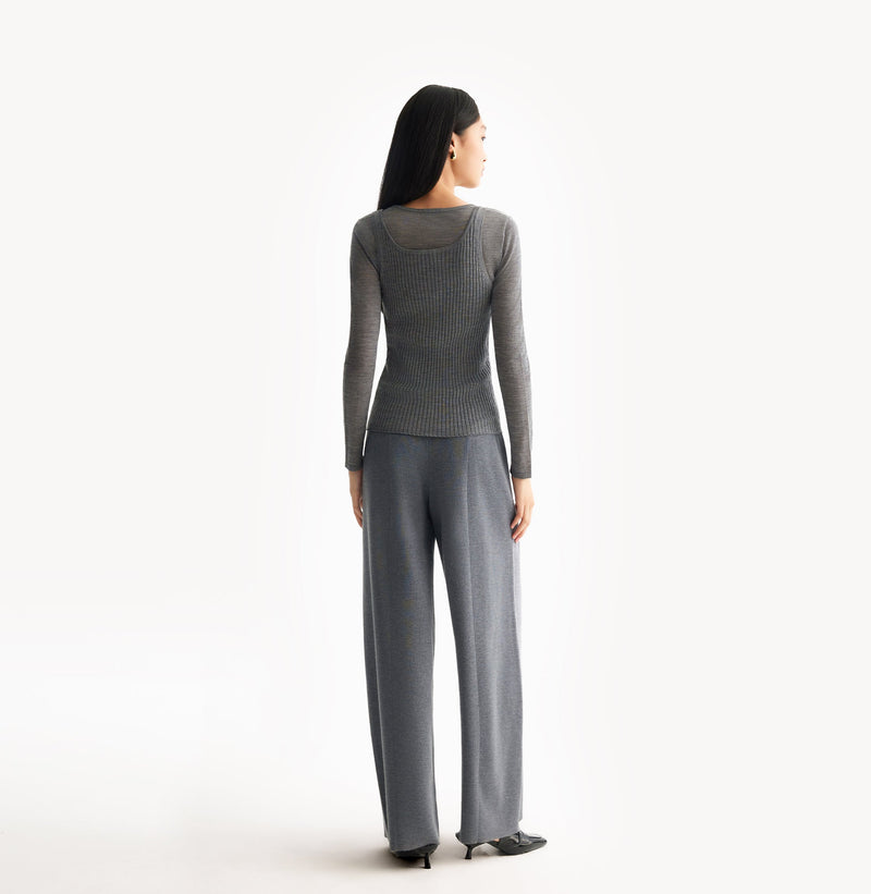 Grey wool layered top in 18 gauge knit with fitted crewneck and dimensional rib jersey texture. rear-view.