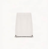 White wool-cashmere midi skirt with faux placket and hand-crocheted trim.