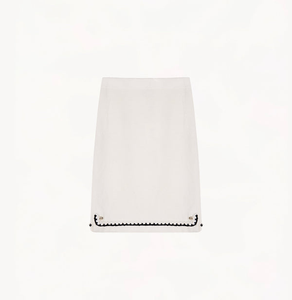 White wool-cashmere midi skirt with faux placket and hand-crocheted trim.