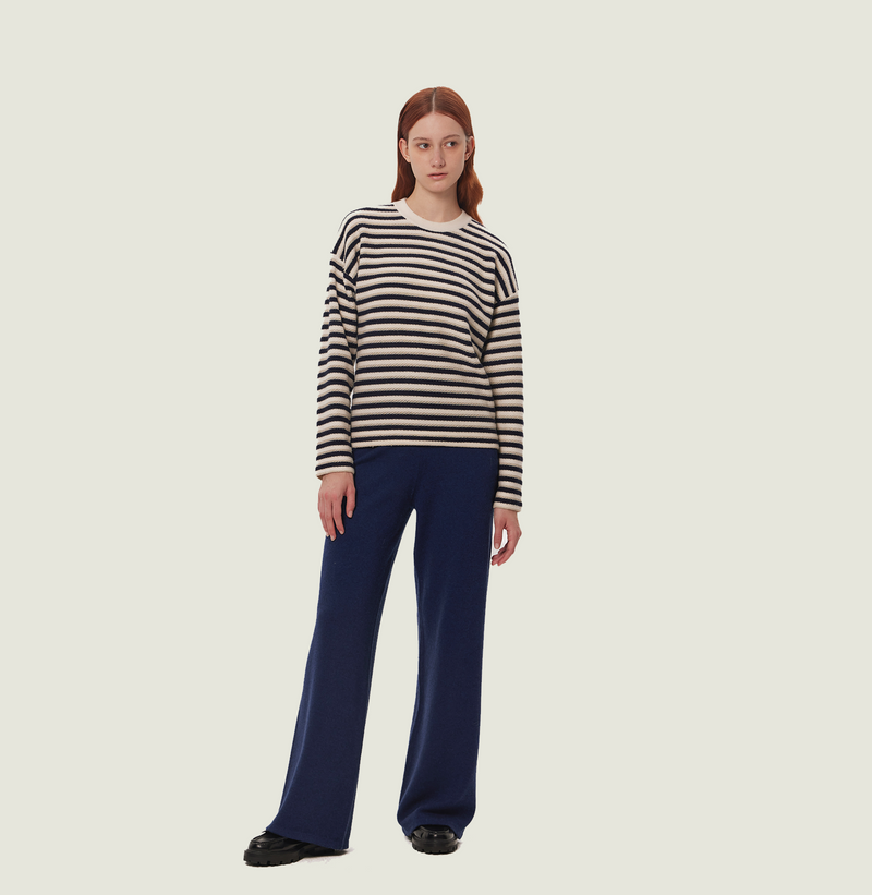 Wool stripped sweater in blue and white jacquard stripes. left-view