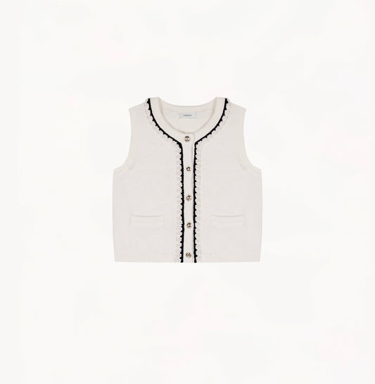 White wool-cashmere vest with hand-crocheted trim and pearl embellishments.