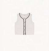 White wool-cashmere vest with hand-crocheted trim and pearl embellishments.