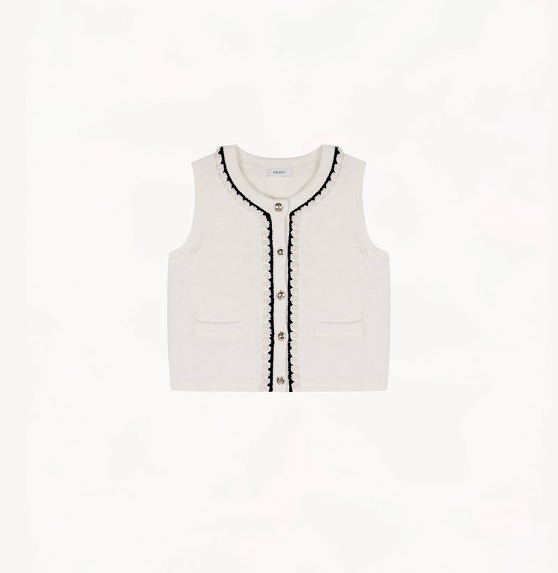 White wool-cashmere vest with hand-crocheted trim and pearl embellishments.