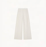 White wool blend wide leg pants with relaxed fit and fluid drape in midweight fabric.