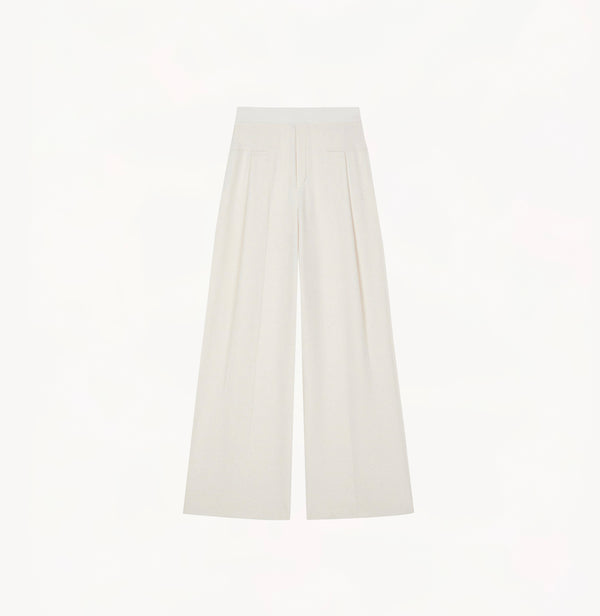 White wool blend wide leg pants with relaxed fit and fluid drape in midweight fabric.