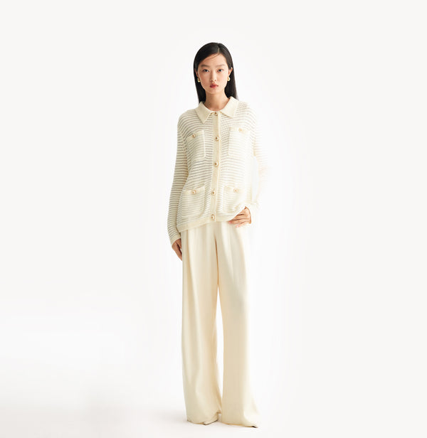 White wool blend wide leg pants with relaxed fit and fluid drape in midweight fabric.front-view.