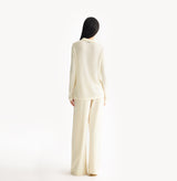 White wool blend wide leg pants with relaxed fit and fluid drape in midweight fabric.rear-view.