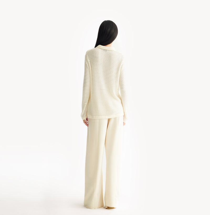 White wool blend wide leg pants with relaxed fit and fluid drape in midweight fabric.rear-view.