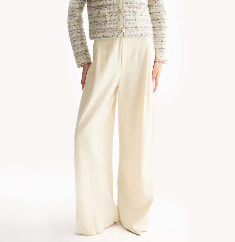 White wool blend wide leg pants with relaxed fit and fluid drape in midweight fabric.left-view.