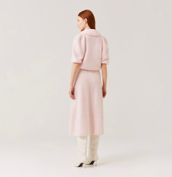 Cashmere puff sleeved cardigan with fur collar in light pink.