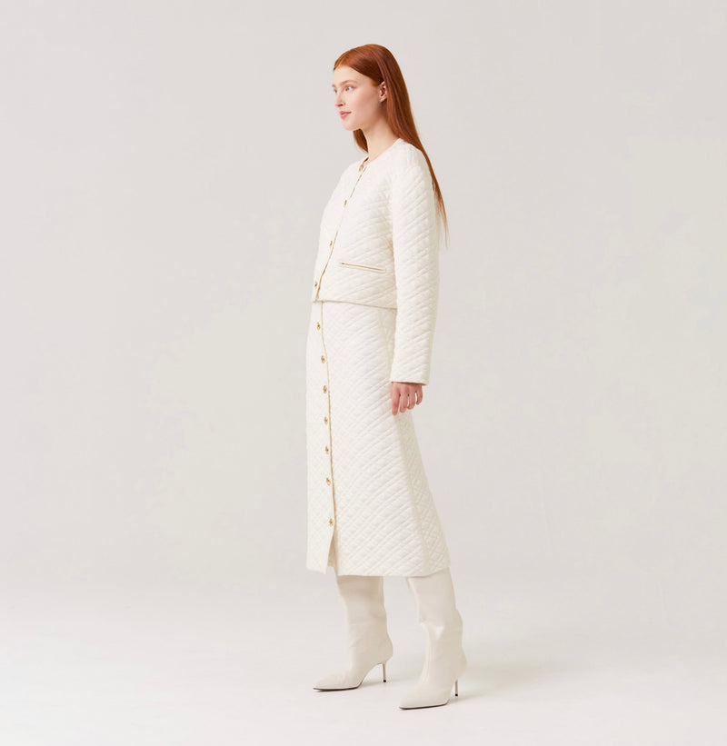 Wool quilted short jacket in white.