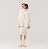 Quilted-knit cape in white. 