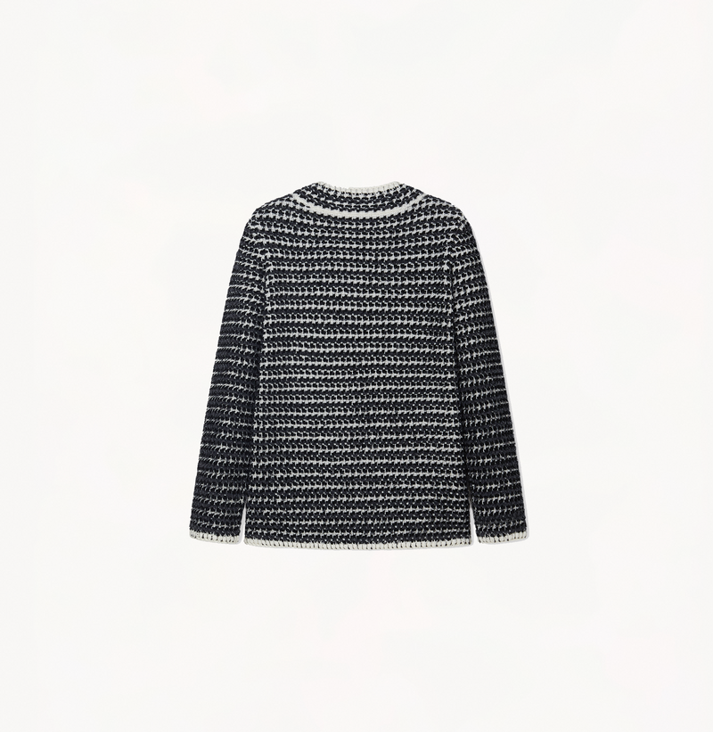 Boucle jacket with a v-neck in black and grey stripes.