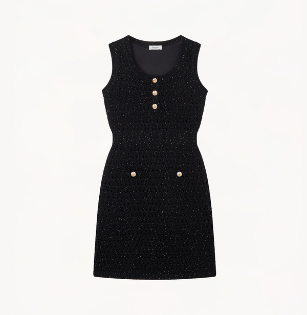 Hollow out dress with sequins in black.