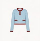 Cashmere colorblock sweater in blue and brown red with buttons in the front.