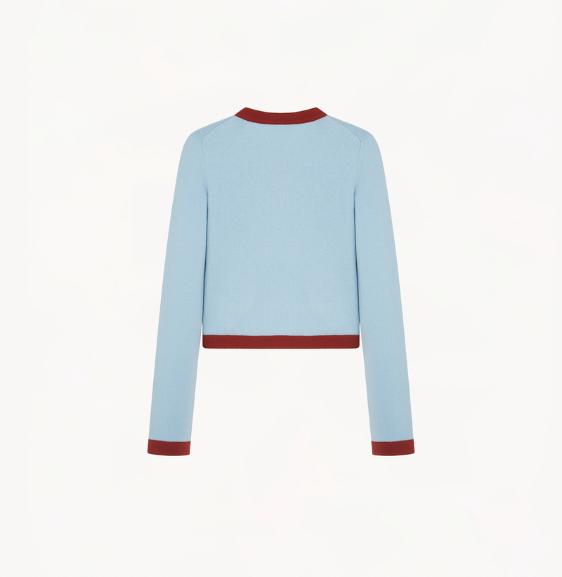 Cashmere colorblock sweater in blue and brown red with buttons in the front.