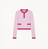 Cashmere colorblock sweater in pink and fushia with buttons in the front.