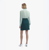 Cotton and cashmere blend mini skirt in green.