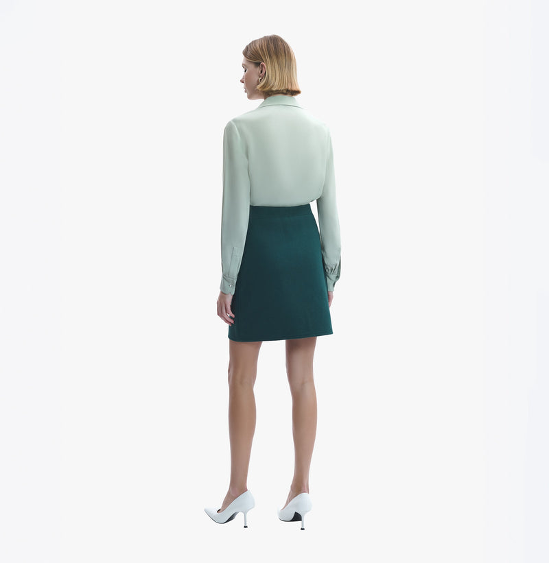 Cotton and cashmere blend mini skirt in green.