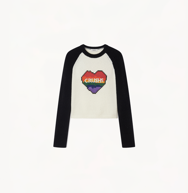 Colorblocked sweater with a heart in charcoal grey and white.