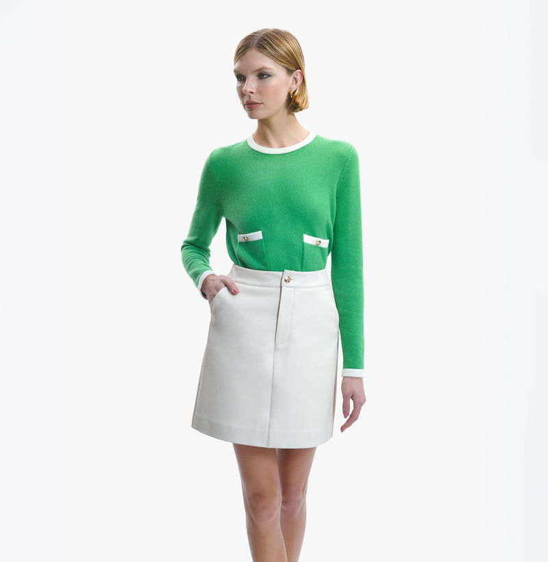 Lambskin leather A-line skirt with front metal buttons in white.