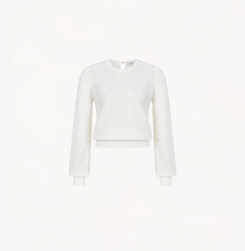 Wool lace top in white with long sleeves.