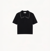 Polo top embellished with pearls in black.