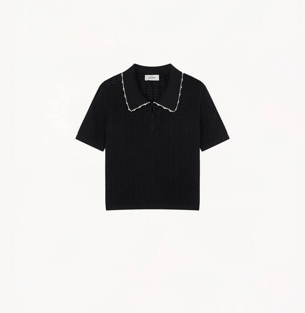 Polo top embellished with pearls in black.
