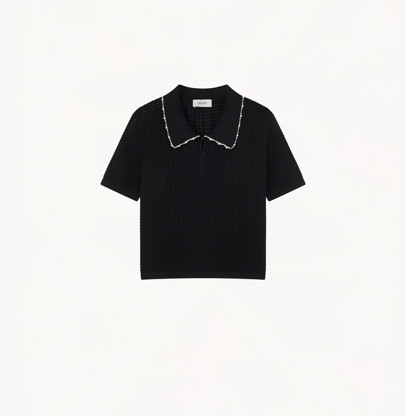 Polo top embellished with pearls in black.